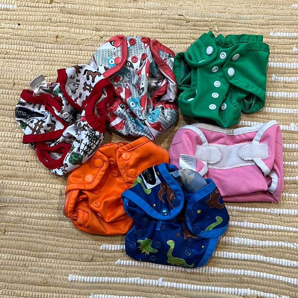Newborn cloth diapers with covers, snappis, and large wet bag